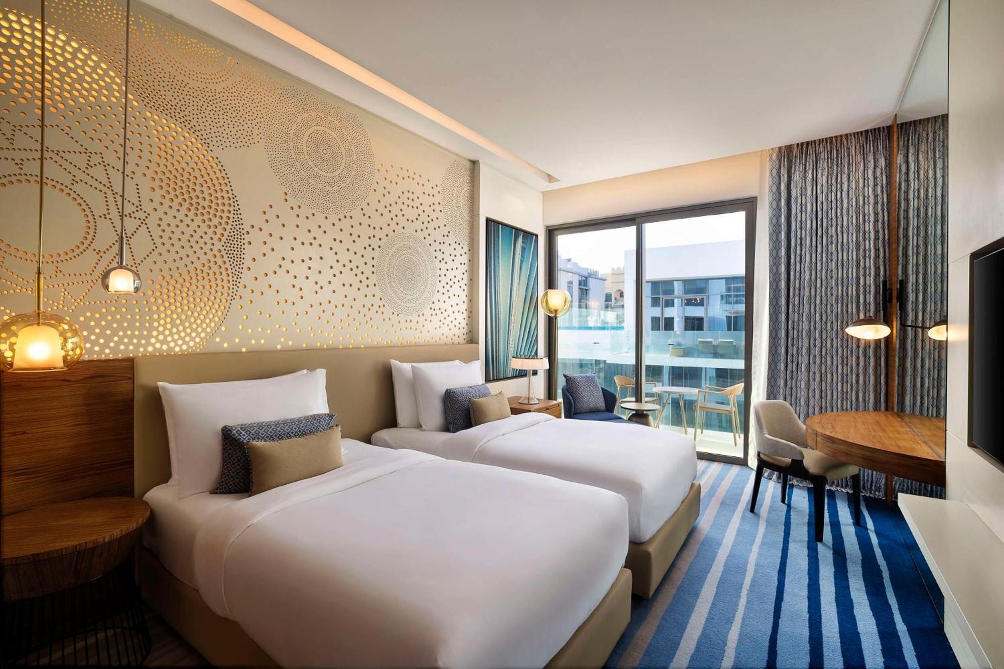 Tumbi West Palm Dubai,tapestry Collection Hilton Hotel